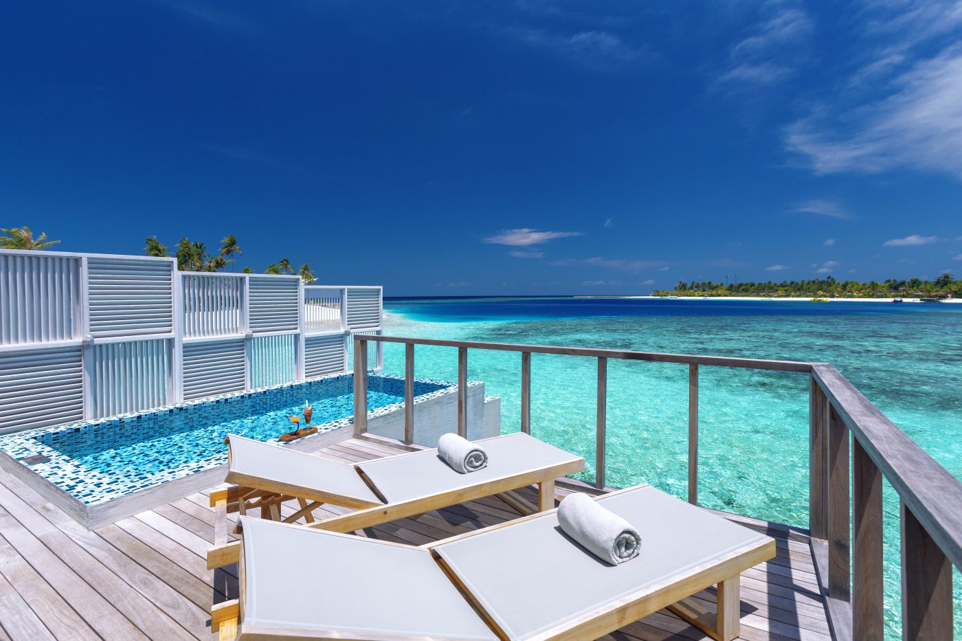 Lagoon view from an overwater villa deck at Sangeli